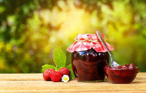 Still,Life,With,Strawberry,Jam,On,Table,With,Sunshine,Blurred